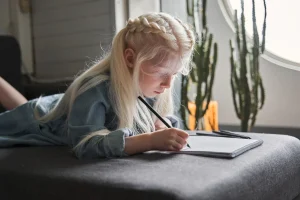 kid-writing-in-the-couch